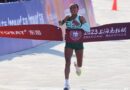 Siranesh Yirga from Ethiopia crosses the finish line at the 2023 Shanghai Marathon.