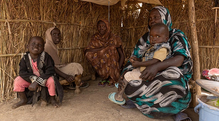 Hawa Ahmed Yassin, a refugees from Sudan, sits with her four children in a Shelter at Kurmuk transit centre near Ethiopia's western border with Sudan. (Image © UNHCR/Tiksa Negeri)